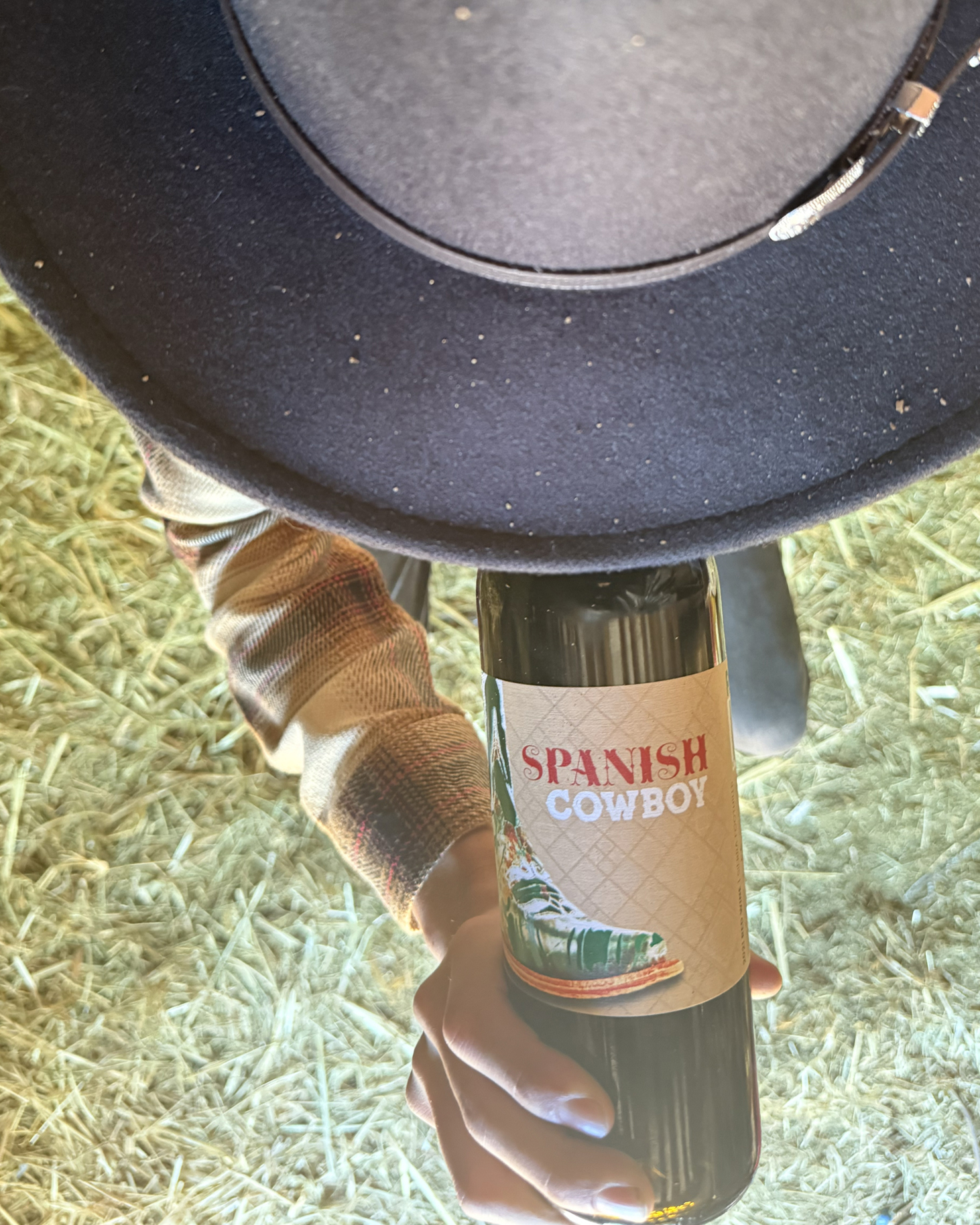 Cowboy drinking a bottle of Spanish Cowboy wine