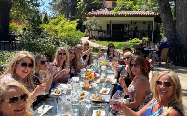 Table of women enjoying a lovely outdoor tasting